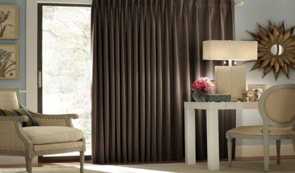 Budget blackout curtains blocking sunlight in a modern bedroom