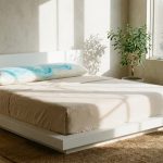 A cooling gel memory foam pillow on a neatly made white bed.